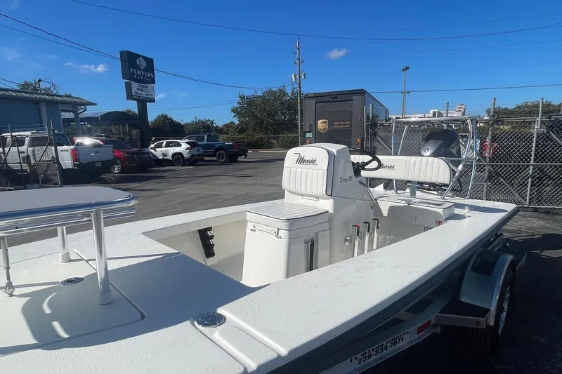 Slide: The Image of 2026 Maverick HPX-17 V boat in parking lot, showcasing sleek design and modern features. - 5