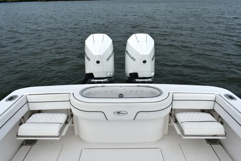 Slide: The Image of Valhalla V-33 2021 boat with dual Mercury engines on open water. - 10