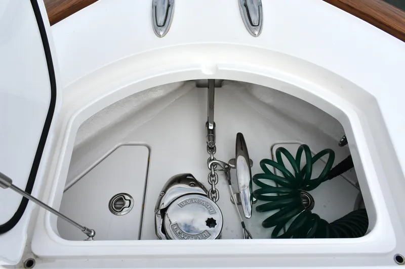 Slide: The Image of Anchor compartment of 2021 Valhalla V-33 boat with chain and hose. - 15