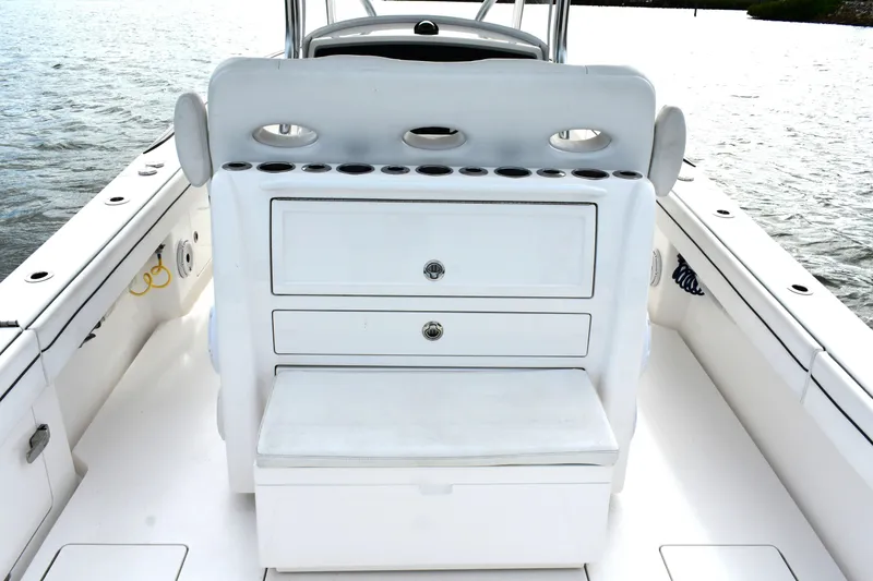 Slide: The Image of Valhalla V-33 2021 boat interior with storage drawers and seating on water. - 2