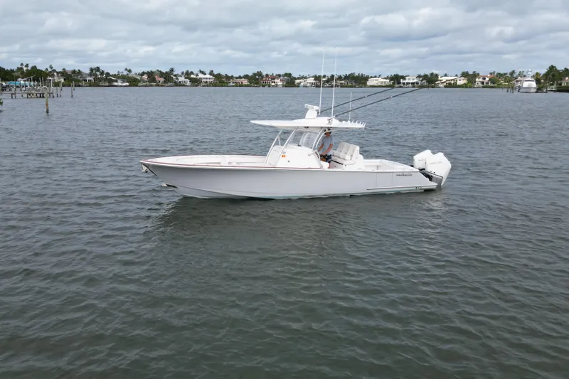 Slide: The Image of 2021 Valhalla Boatworks V-33 on calm waters, showcasing sleek design and powerful engines. - 20