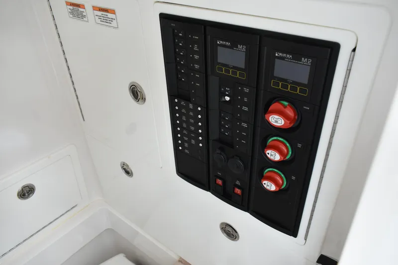 Slide: The Image of Electrical control panel on 2021 Valhalla V-33 boat, featuring switches and gauges. - 7