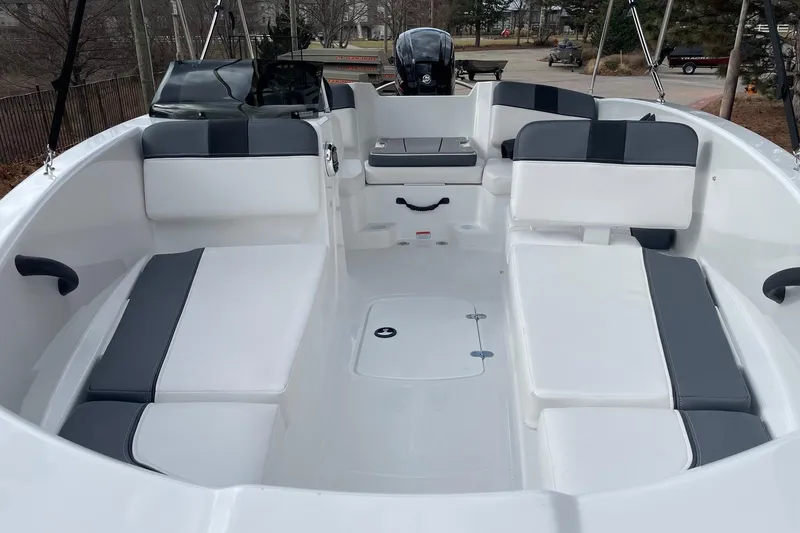 Slide: The Image of 2026 Tahoe T16 boat interior with white and gray seating, spacious layout. - 4
