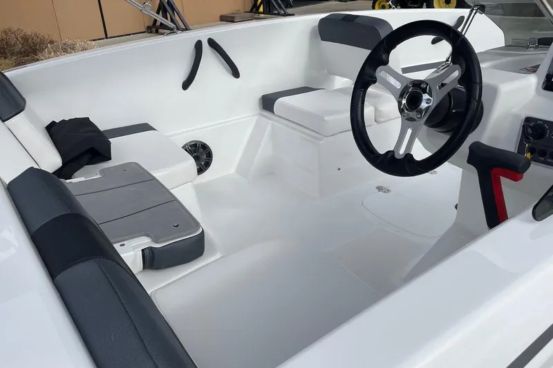 Slide: The Image of Interior of 2026 Tahoe T16 boat with modern steering wheel. - 5