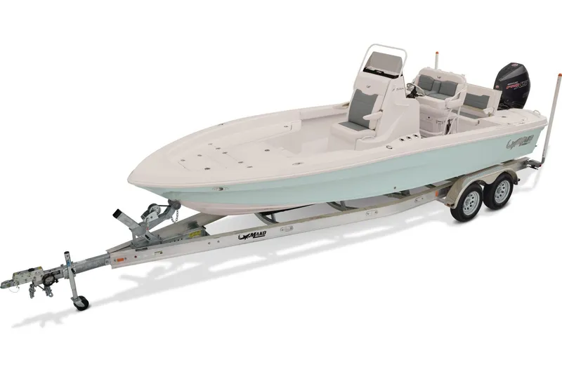 Slide: The Image of 2026 Mako 24 APEX boat on trailer, parked on snowy ground, surrounded by trees. - 1