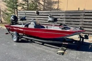 The Image of 2026 Tracker Bass Tracker Classic XL boat on trailer, parked outdoors. - 0