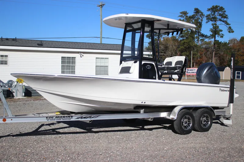 The Image of 2026 Tidewater 2210 Carolina Bay boat on trailer, parked outdoors. - 1