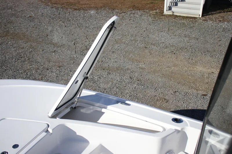 Slide: The Image of Open storage compartment on a 2026 Tidewater 2210 Carolina Bay boat. - 10