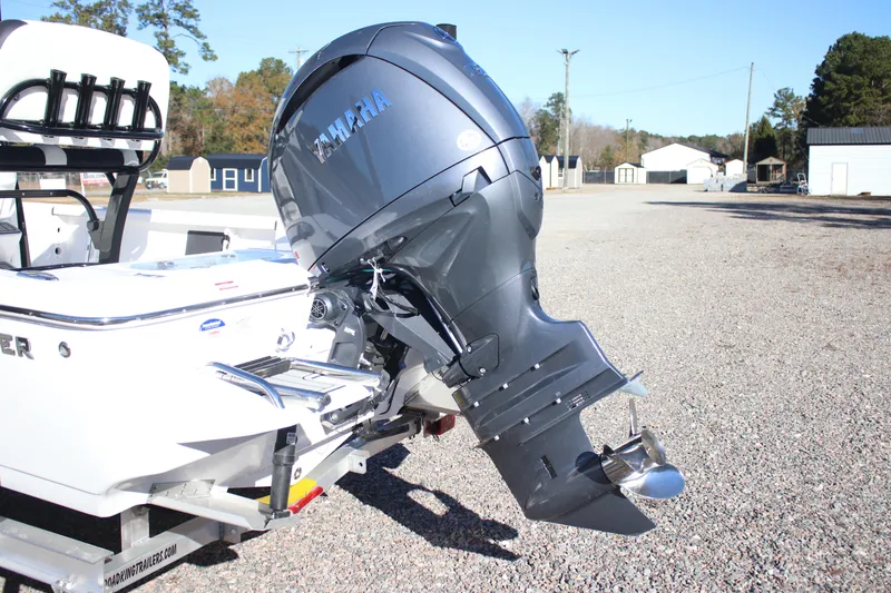 Slide: The Image of 2026 Tidewater 2210 Carolina Bay boat with Yamaha outboard motor on a gravel lot. - 24