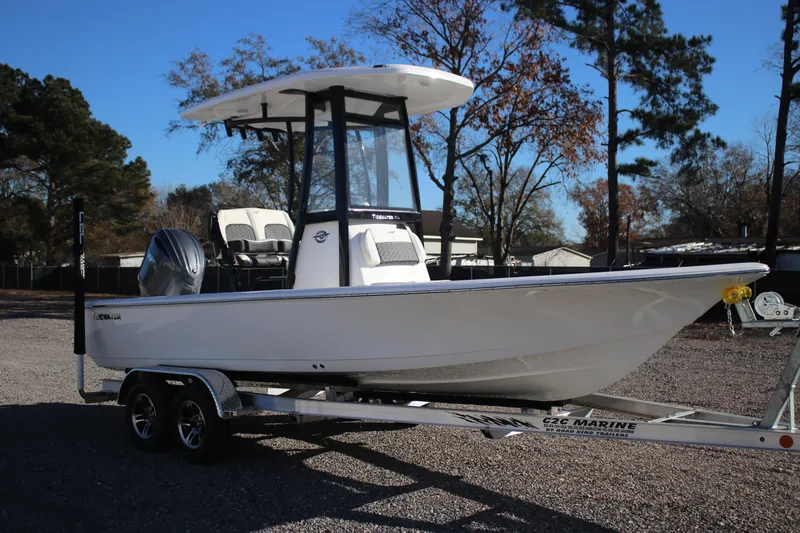Slide: The Image of 2026 Tidewater 2210 Carolina Bay boat on trailer, parked outdoors. - 3