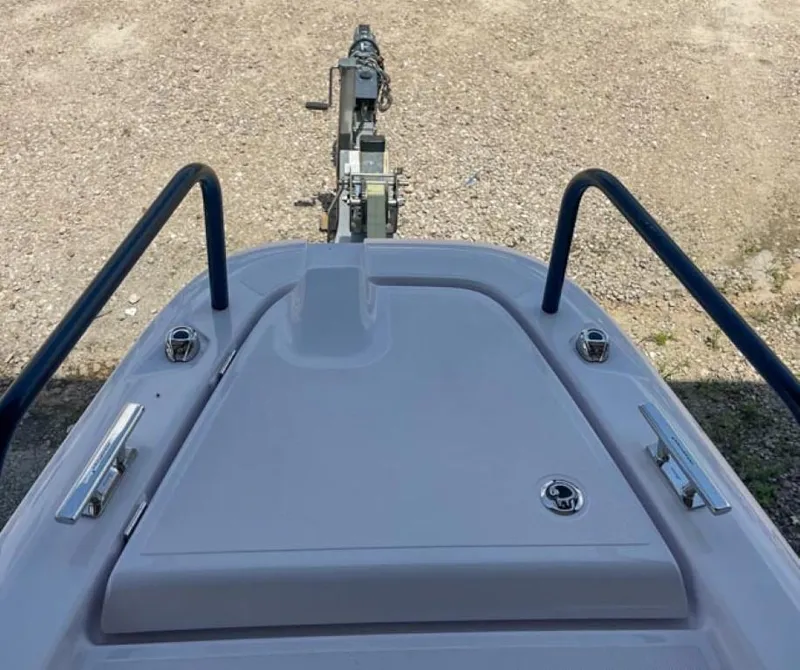 Slide: The Image of 2024 Axopar 25 Cross Top boat bow with trailer attachment. - 4
