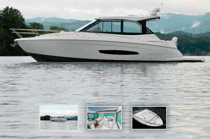 The Image of 2026 Regal 36 Grande Coupe luxury yacht on serene lake with scenic mountain backdrop. - 0