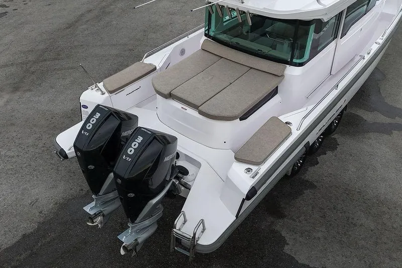 Slide: The Image of 2023 Axopar 37 XC Cross Cabin with twin Mercury outboard engines, aerial view. - 18