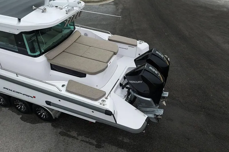 Slide: The Image of 2023 Axopar 37 XC Cross Cabin with triple Mercury outboard engines, rear deck view. - 19