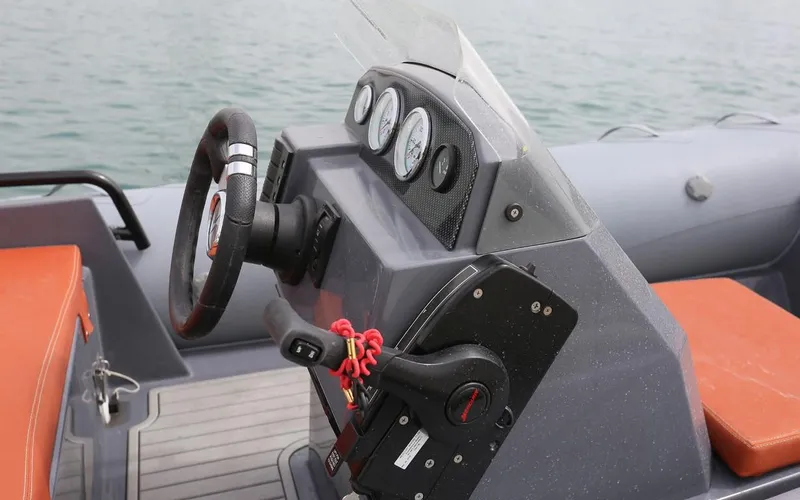 Slide: The Image of 2024 Northstar Axis 4.2 boat dashboard with steering wheel and control panel. - 6