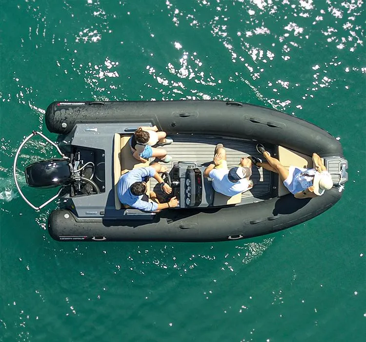 Slide: The Image of 2023 Northstar Axis 4.2 inflatable boat with passengers on clear blue water. - 12