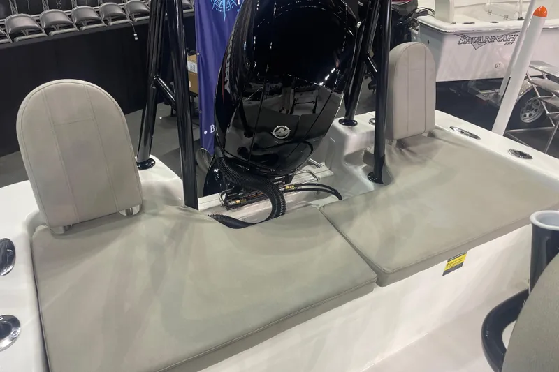 Slide: The Image of 2023 Savannah SS21 boat interior with cushioned seating and sleek design. - 17