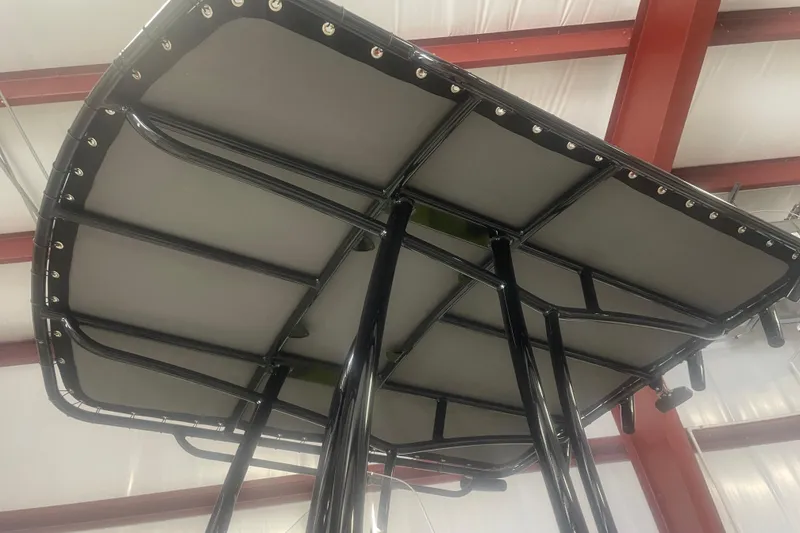 Slide: The Image of 2023 Savannah SS21 boat T-top frame in a warehouse setting. - 3