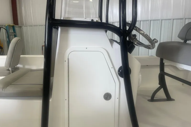 Slide: The Image of 2023 Savannah SS21 boat interior with steering console and seating. - 4