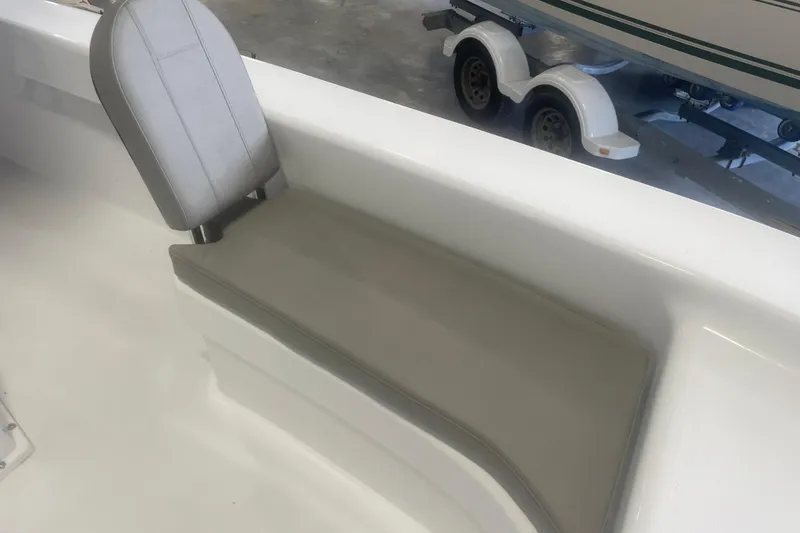 Slide: The Image of Boat interior with gray cushioned seat, Savannah SS21 model, 2023. - 6