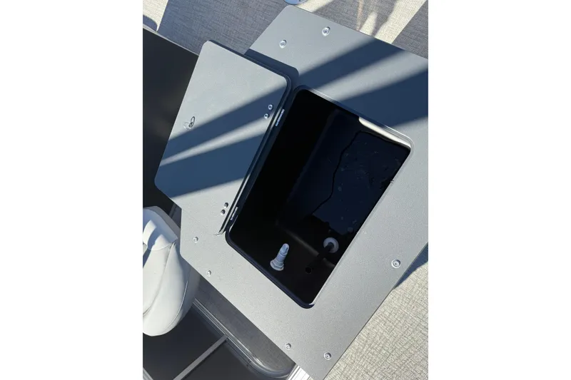 Slide: The Image of Open storage compartment on 2026 Avalon VENTURE 85 QUAD boat deck. - 12