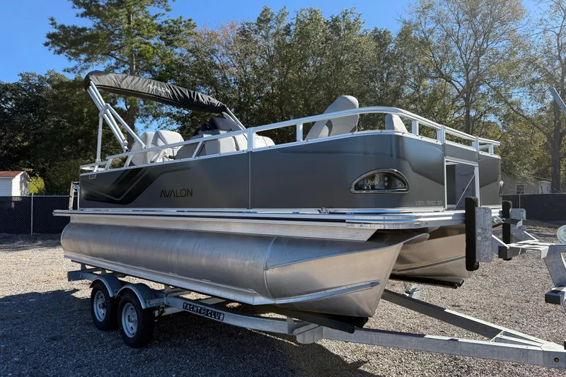 Slide: The Image of Avalon VENTURE 85 QUAD 2026 pontoon boat on trailer, parked outdoors. - 14