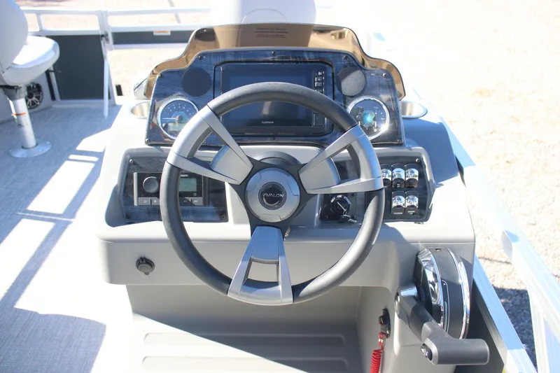 Slide: The Image of Steering console of 2026 Avalon VENTURE 85 QUAD boat with modern controls and dashboard. - 6