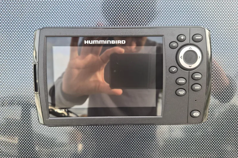 Slide: The Image of Humminbird Helix 5 fish finder on Xpress H22B Bay 2026 boat dashboard. - 16