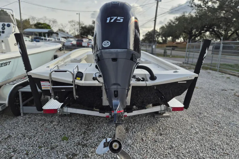 Slide: The Image of 2026 Xpress H22B Bay boat with 175 horsepower engine on gravel lot. - 8