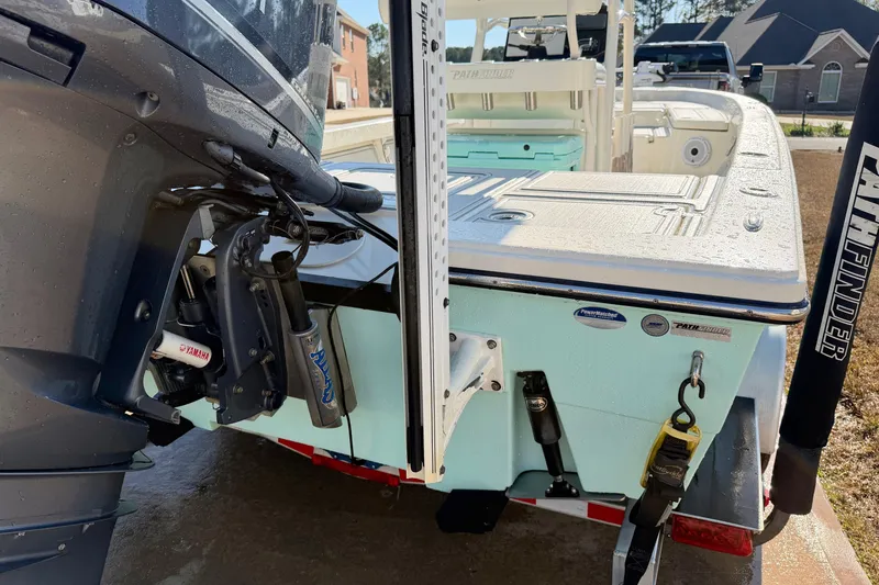 Slide: The Image of 2015 Pathfinder 2400 TRS boat with Yamaha engine, parked on a trailer. - 3