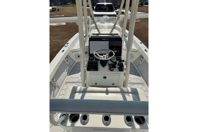 Slide: The Image of 2015 Pathfinder 2400 TRS boat interior with steering console and seating. - 6