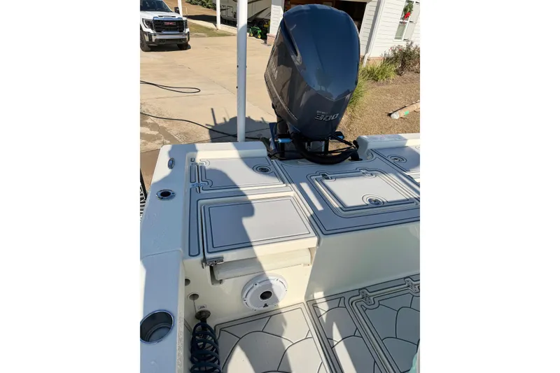 Slide: The Image of 2015 Pathfinder 2400 TRS boat with powerful outboard motor in driveway. - 7