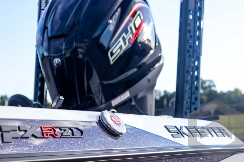 Slide: The Image of 2026 Skeeter FXR21 FLEX boat with powerful outboard motor, close-up view. - 14