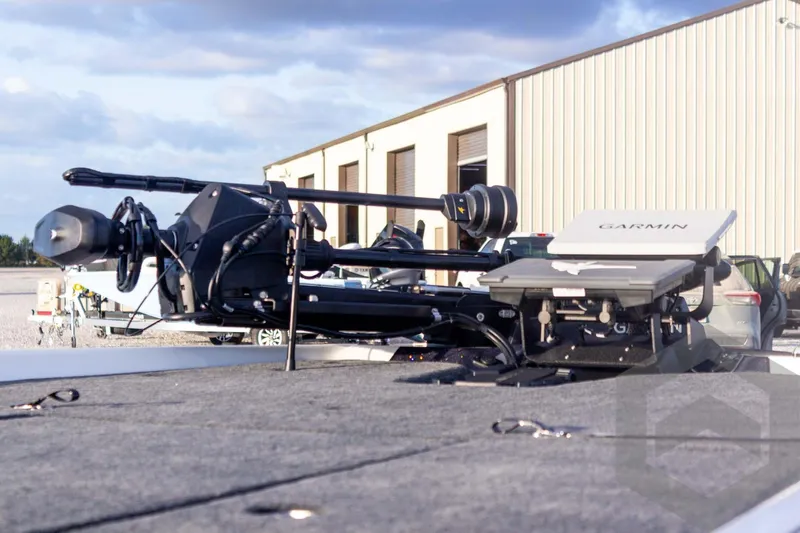 Slide: The Image of 2026 Skeeter FXR21 FLEX boat with Garmin equipment, parked outdoors. - 20