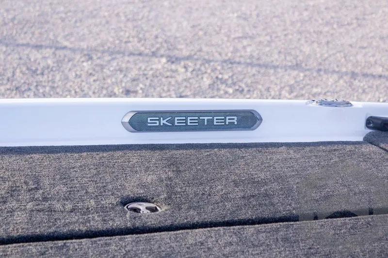 Slide: The Image of 2026 Skeeter FXR21 FLEX boat deck with logo detail. - 21