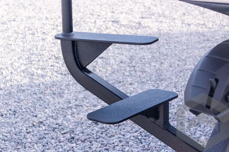 Slide: The Image of 2026 Skeeter FXR21 FLEX trailer step detail on gravel surface. - 23