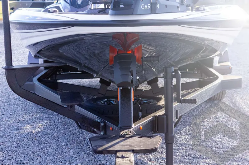Slide: The Image of 2026 Skeeter FXR21 FLEX boat on trailer, close-up view of hull and trailer components. - 24