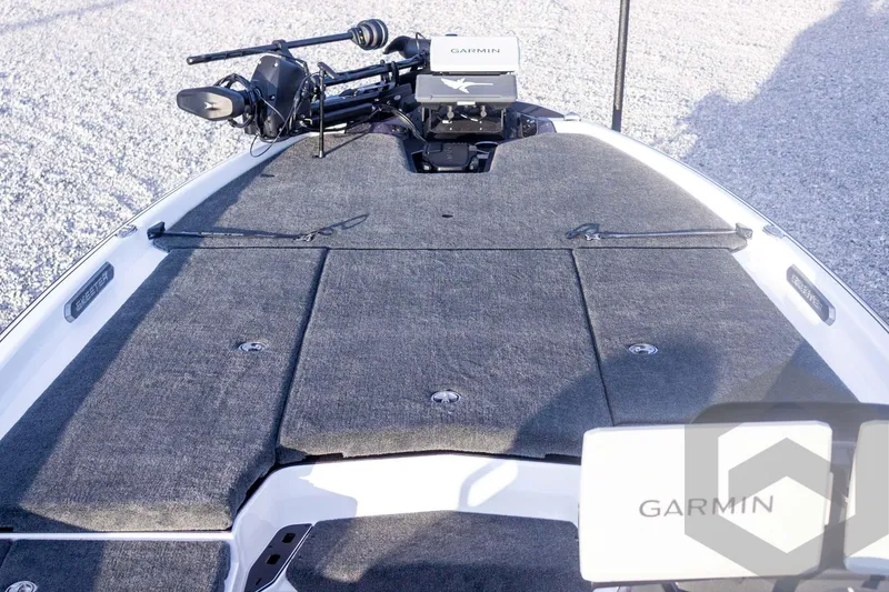 Slide: The Image of 2026 Skeeter FXR21 FLEX boat deck with Garmin equipment, featuring a sleek, carpeted surface. - 25