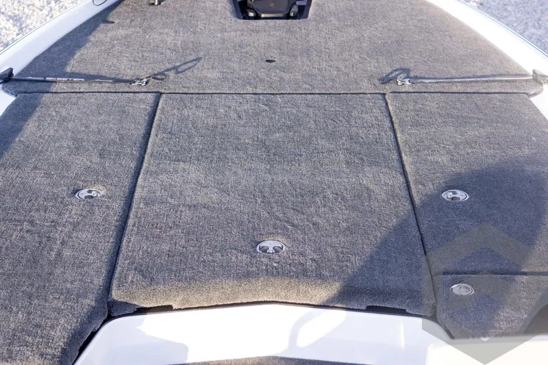 Slide: The Image of 2026 Skeeter FXR21 FLEX boat deck with gray carpet and storage compartments. - 31