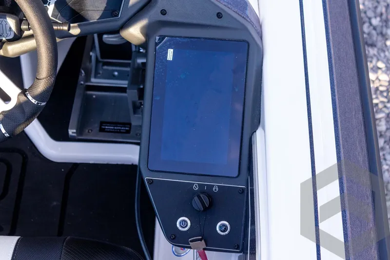 Slide: The Image of 2026 Skeeter FXR21 FLEX boat dashboard with touchscreen and steering wheel. - 42