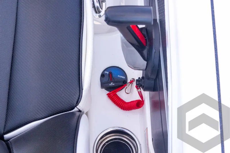 Slide: The Image of 2026 Skeeter FXR21 FLEX boat interior with control panel and red safety cord. - 43