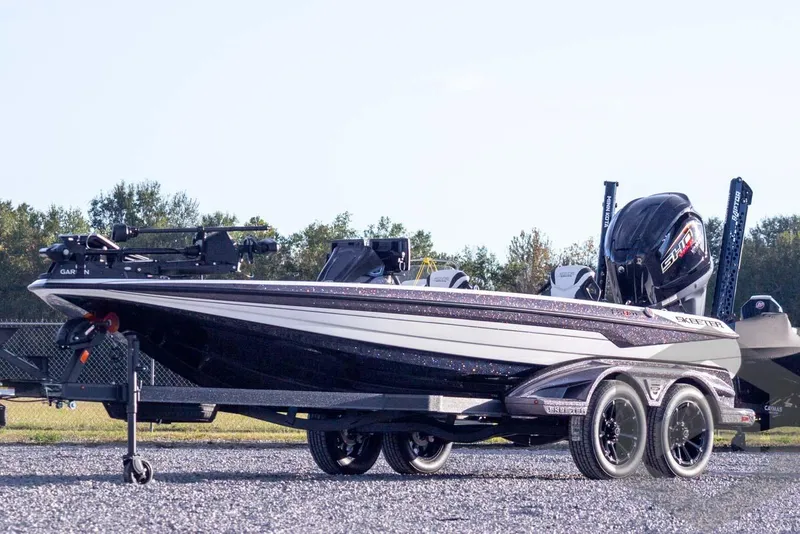 The Image of 2026 Skeeter FXR21 FLEX boat on trailer, featuring sleek design and powerful engine. - 5
