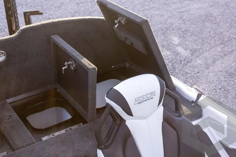 Slide: The Image of 2026 Skeeter FXR21 FLEX boat interior with storage compartments and FXR Series seat. - 52