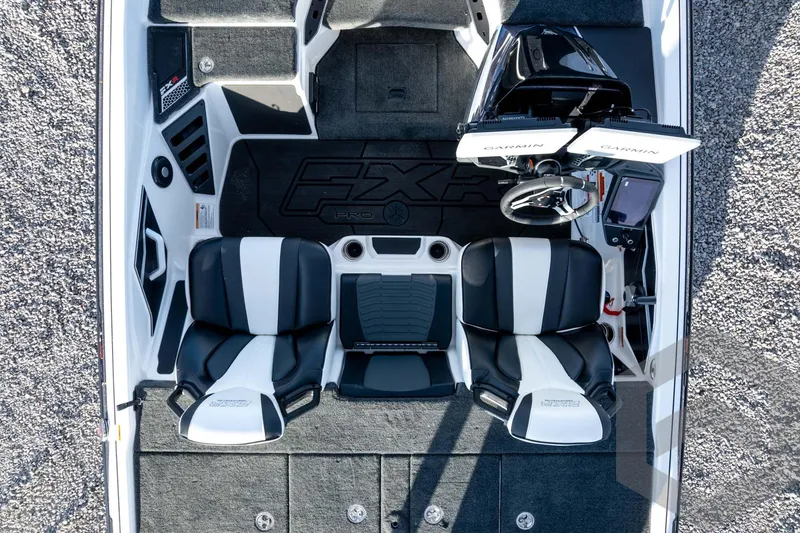 Slide: The Image of 2026 Skeeter FXR21 FLEX boat interior with dual seats and Garmin electronics. - 57