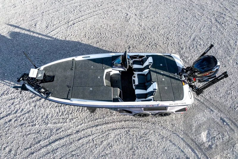 Slide: The Image of 2026 Skeeter FXR21 FLEX fishing boat on gravel surface, aerial view. - 60