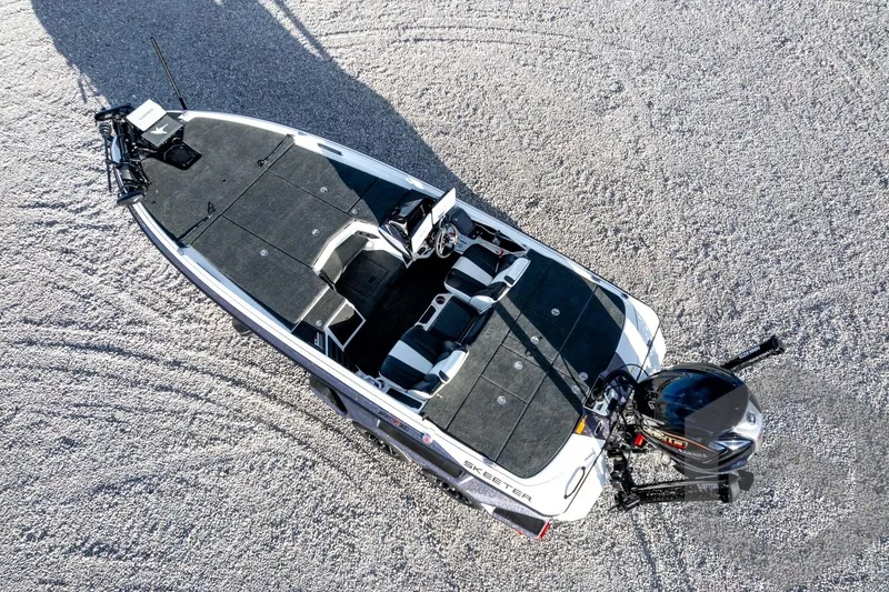 Slide: The Image of 2026 Skeeter FXR21 FLEX boat, aerial view on gravel surface. - 61