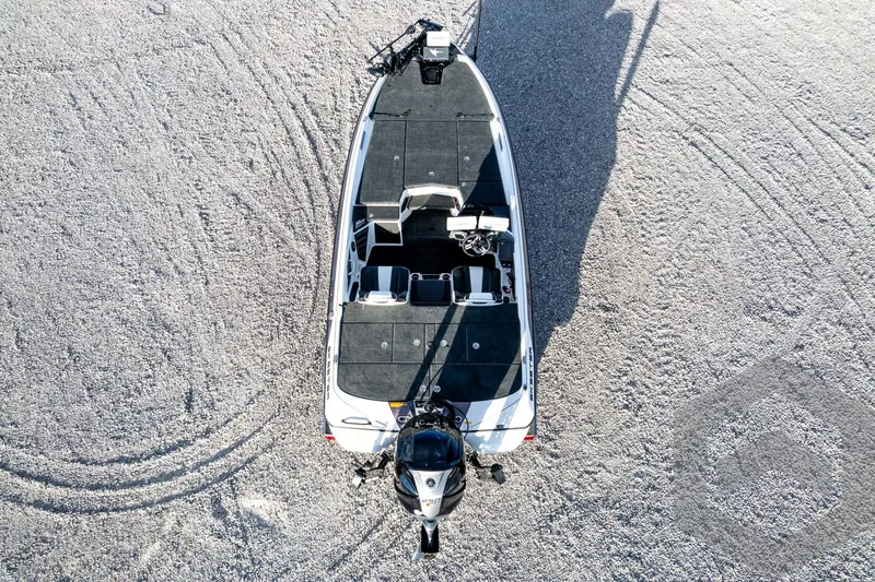 Slide: The Image of Overhead view of 2026 Skeeter FXR21 FLEX boat on gravel surface. - 62