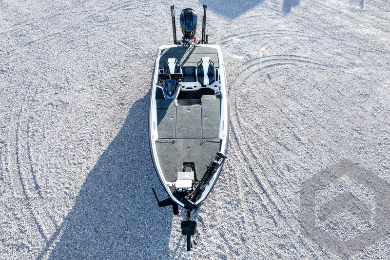 Slide: The Image of 2026 Skeeter FXR21 FLEX boat on gravel surface, aerial view. - 66