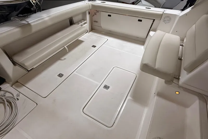 Slide: The Image of 2004 Tiara Yachts 3800 Open boat deck with railing and hatch. - 12