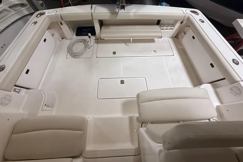 Slide: The Image of 2004 Tiara Yachts 3800 Open in storage, showcasing sleek design and spacious cabin. - 13